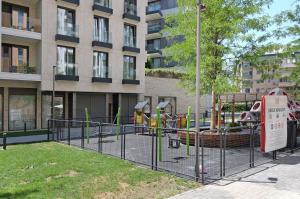 a playground in front of a building at New Luxury Dorcol Downtown Apartment in Belgrade