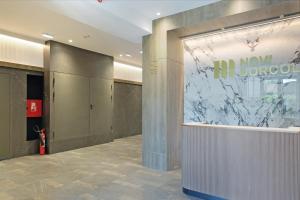 a lobby with a large window in a building at New Luxury Dorcol Downtown Apartment in Belgrade