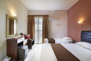Postel nebo postele na pokoji v ubytování Hotel Rema