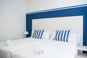 Posteľ alebo postele v izbe v ubytovaní Hotel Náutico Santander