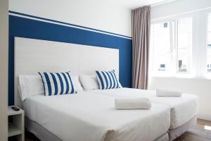Posteľ alebo postele v izbe v ubytovaní Hotel Náutico Santander