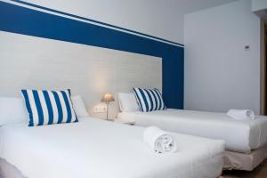 Posteľ alebo postele v izbe v ubytovaní Hotel Náutico Santander