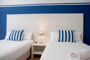 Posteľ alebo postele v izbe v ubytovaní Hotel Náutico Santander