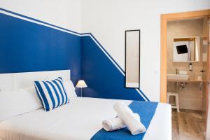 Posteľ alebo postele v izbe v ubytovaní Hotel Náutico Santander