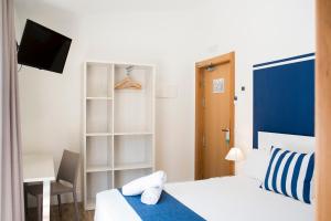 Posteľ alebo postele v izbe v ubytovaní Hotel Náutico Santander