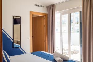 Posteľ alebo postele v izbe v ubytovaní Hotel Náutico Santander