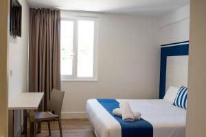 Posteľ alebo postele v izbe v ubytovaní Hotel Náutico Santander