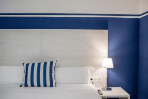 Posteľ alebo postele v izbe v ubytovaní Hotel Náutico Santander