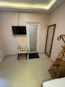 a living room with a table and a door at Kwality Beach Resort in Beni Ghāt