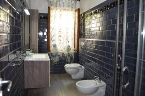 a bathroom with a toilet and a sink at Villa Elba Mare & Relax Capoliveri in Capoliveri +17 photos