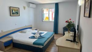 Postel nebo postele na pokoji v ubytování Hotel Hercules Jupiter