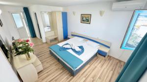 Postel nebo postele na pokoji v ubytování Hotel Hercules Jupiter + 28 fotografií
