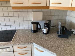 a kitchen counter with a coffeemaker and a coffee maker at Chill out Zone in Kraubath an der Mur