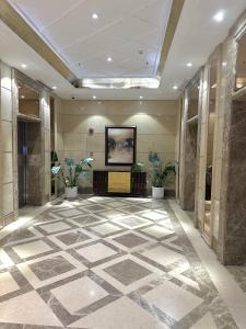 a lobby with a large tile floor in a building at ZHome-Count luxury apartment in Shanghai +29 photos