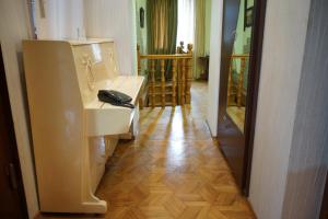 a room with a white counter and a room with a hallway at Guest House 20 in Tbilisi City