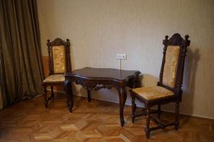 a table and two chairs in a room at Guest House 20 in Tbilisi City
