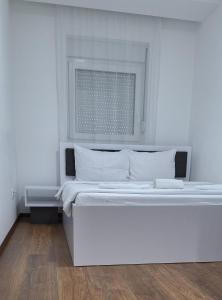 Postel nebo postele na pokoji v ubytování S-Apartmani Cocetova