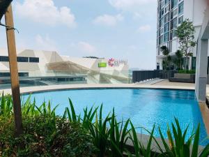 a swimming pool in the middle of a building at Vintage Homes at i-City - WiFi TV Box 1 Carpark in Shah Alam +7 photos