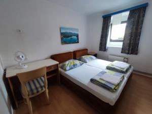 Postel nebo postele na pokoji v ubytování Guesthouse Veles