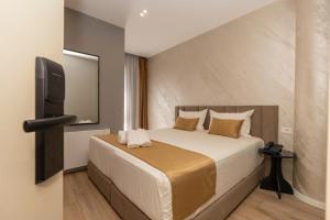 Voodi või voodid majutusasutuse Alko Hotel Bushat toas