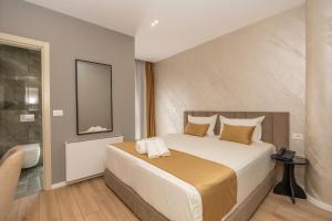 Voodi või voodid majutusasutuse Alko Hotel Bushat toas