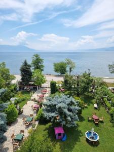 an aerial view of a park with tables and chairs at Villa Enhalon in Struga