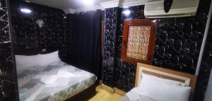 Voodi või voodid majutusasutuse Cairo hotel toas