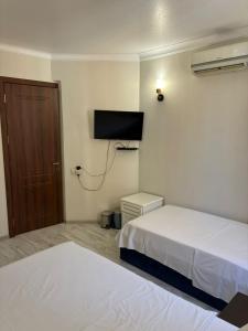 Postel nebo postele na pokoji v ubytování K17 mini hotel