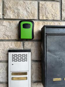a green and white toaster next to a wall at Apartman Petrić in Rijeka