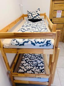 Postel nebo postele na pokoji v ubytování Golden Hostel