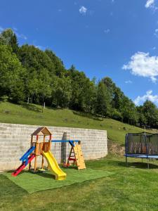 a playground with a slide and a slideintend at Podhorský Apartmány Terchová in Terchová