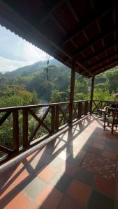 a balcony of a house with a view of a valley at Hotel Boutique Albania in Otanche