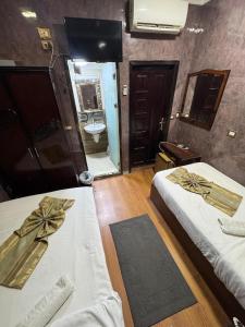 Voodi või voodid majutusasutuse Cairo hotel toas