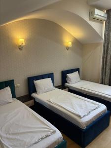 Postel nebo postele na pokoji v ubytování K17 mini hotel