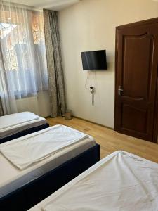 Postel nebo postele na pokoji v ubytování K17 mini hotel