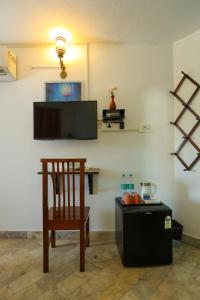 TV a/nebo společenská místnost v ubytování Le Clarisse Guest House
