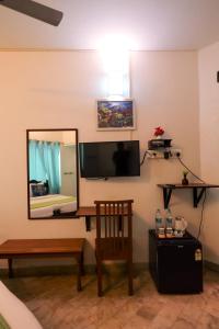 TV a/nebo společenská místnost v ubytování Le Clarisse Guest House