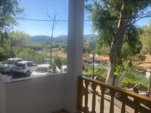 a balcony with a view of cars parked in a parking lot at Liberty-Studio N1 in Georgioupolis