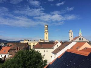 a view of a city with two towers and roofs at Ferienwohnung G Mauke in Zittau