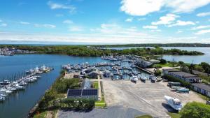 an aerial view of a marina with boats in the water at Dockside 2BR - Marina - Dining - Charter Access Unit A in Montauk