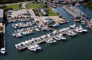 an aerial view of a marina with boats in the water at Dockside 2BR - Marina - Dining - Charter Access Unit A in Montauk