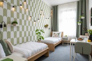 Postel nebo postele na pokoji v ubytování Riverside Hotel by Goodnite cz