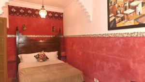 Postel nebo postele na pokoji v ubytování RIAD DAR En-Nawat