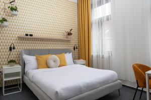 Postel nebo postele na pokoji v ubytování Riverside Hotel by Goodnite cz