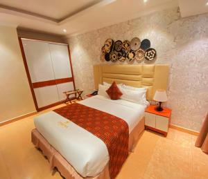 Ein Bett oder Betten in einem Zimmer der Unterkunft Urban Park Suites Hotel