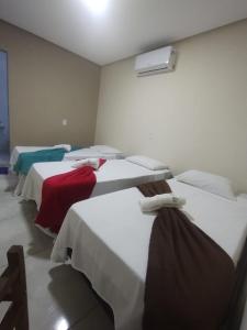 Cama ou camas em um quarto em Pousada Vista da Serra - Suzart
