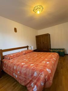 En eller flere senge i et værelse på Appartamento Montebello + 15 billeder