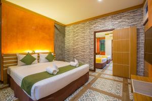 Postel nebo postele na pokoji v ubytování Tee Pak Dee Resident Phuket