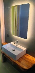 a bathroom with a white sink and a mirror at Hotel Residence Il Rifugio in Palinuro +52 photos