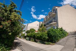 an empty street in a city with buildings at Guest House Villa Bellevue 1 in Cavtat